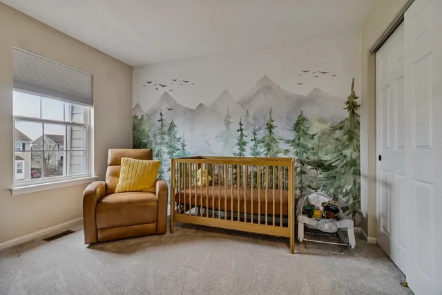 a bedroom with furniture and a window