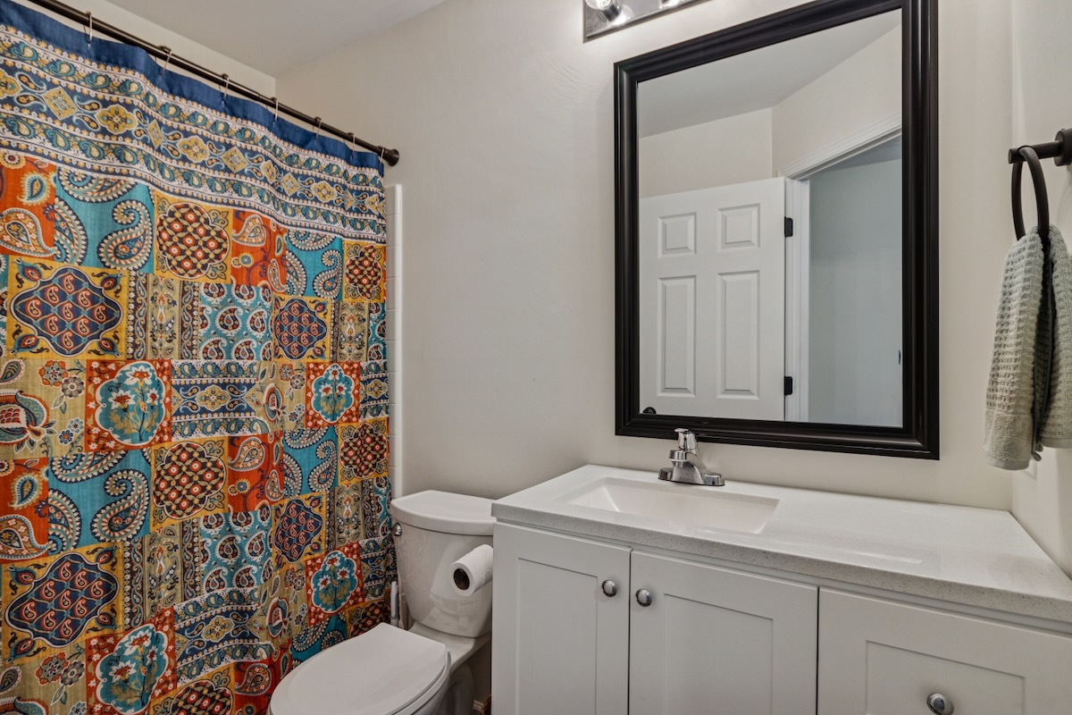 2416 Courtyard Circle, Unit 2 Aurora, IL 60506 - Photo 18 of 22 a bathroom with a sink toilet and shower