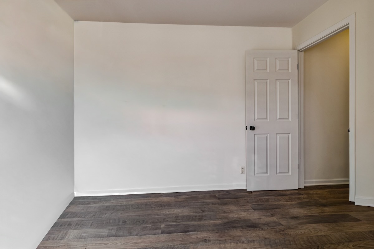 2416 Courtyard Circle, Unit 2 Aurora, IL 60506 - Photo 20 of 22 a view of an empty room with wooden floor