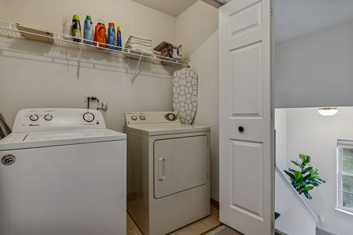 2416 Courtyard Circle, Unit 2 Aurora, IL 60506 - Photo 21 of 22 a utility room with dryer and washer
