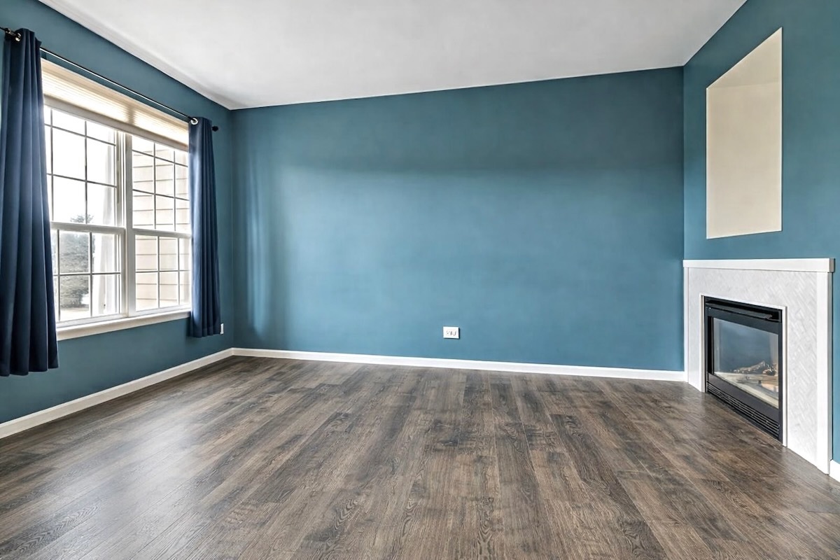 2416 Courtyard Circle, Unit 2 Aurora, IL 60506 - Photo 3 of 22 a view of an empty room with a window and fireplace