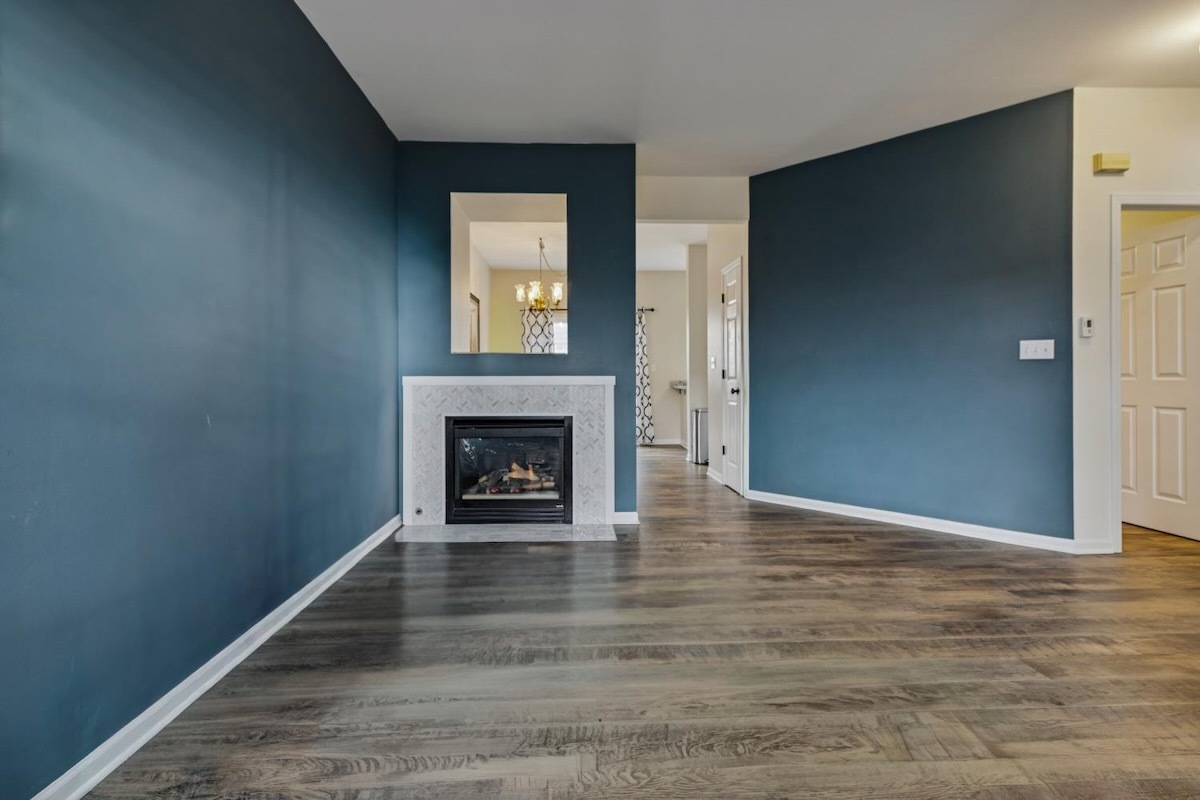 2416 Courtyard Circle, Unit 2 Aurora, IL 60506 - Photo 6 of 22 a view of an empty room with window and fire place