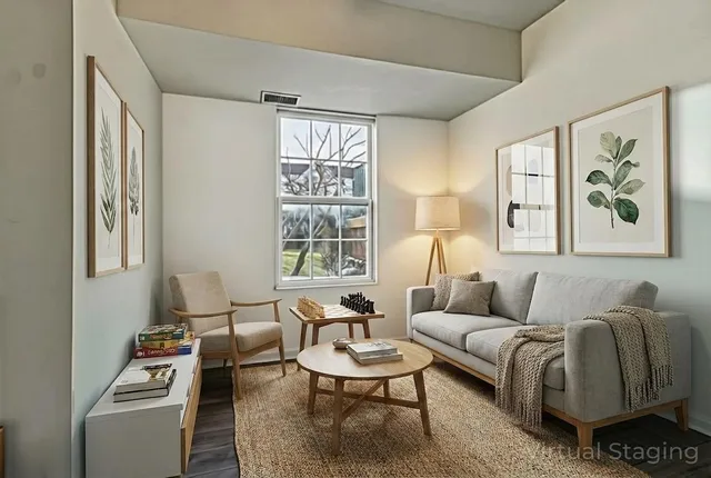 a living room with furniture and a large window