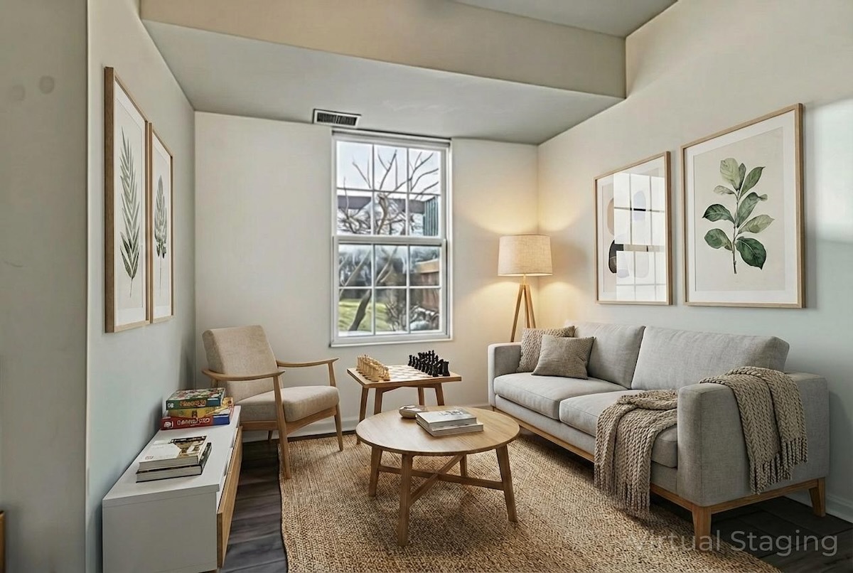 2416 Courtyard Circle, Unit 2 Aurora, IL 60506 - Photo 7 of 22 a living room with furniture and a large window