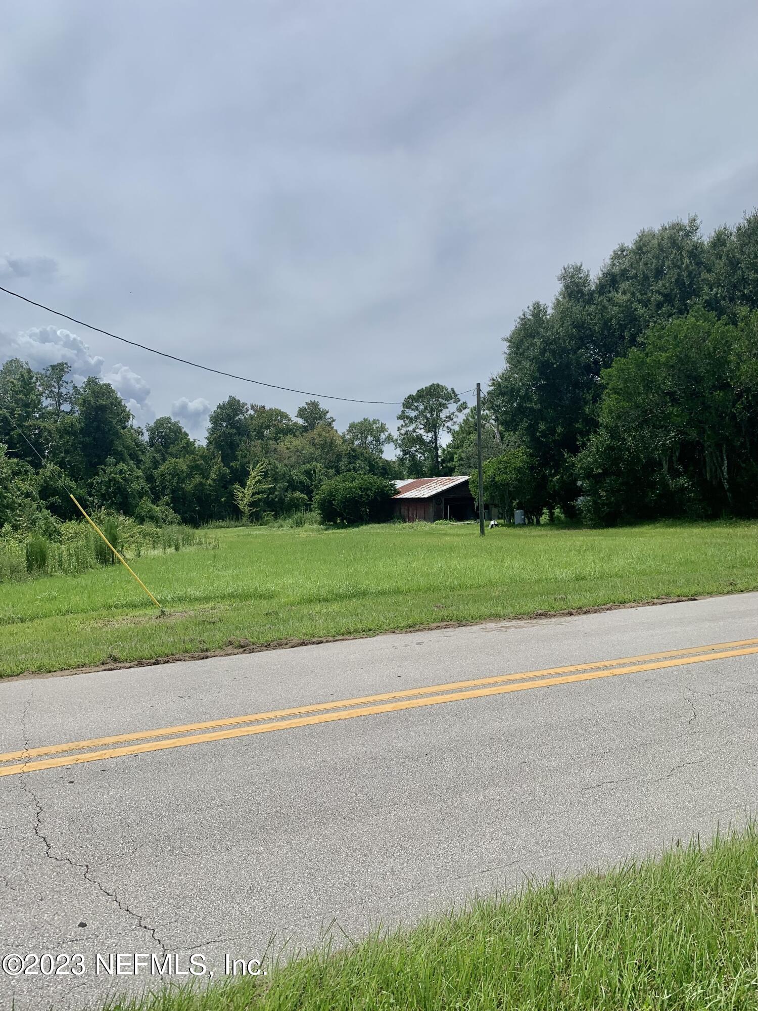 417 Raulerson Road Seville, FL 32190 - Photo 1 of 12 a view of a golf course