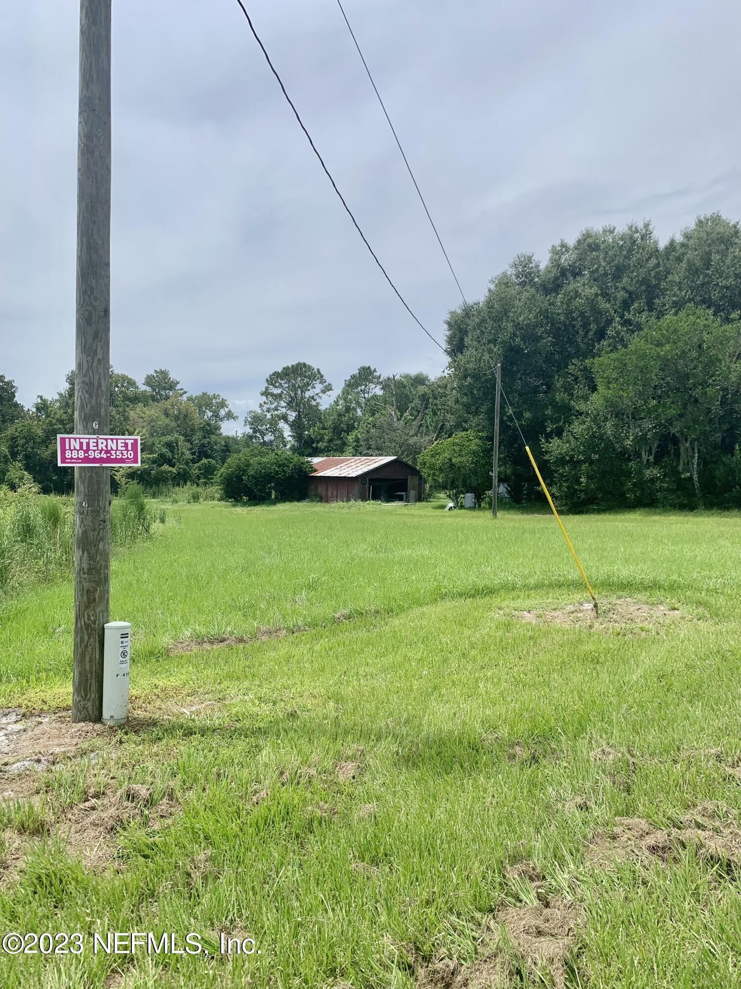 417 Raulerson Road Seville, FL 32190 - Photo 7 of 12 a view of a basketball court