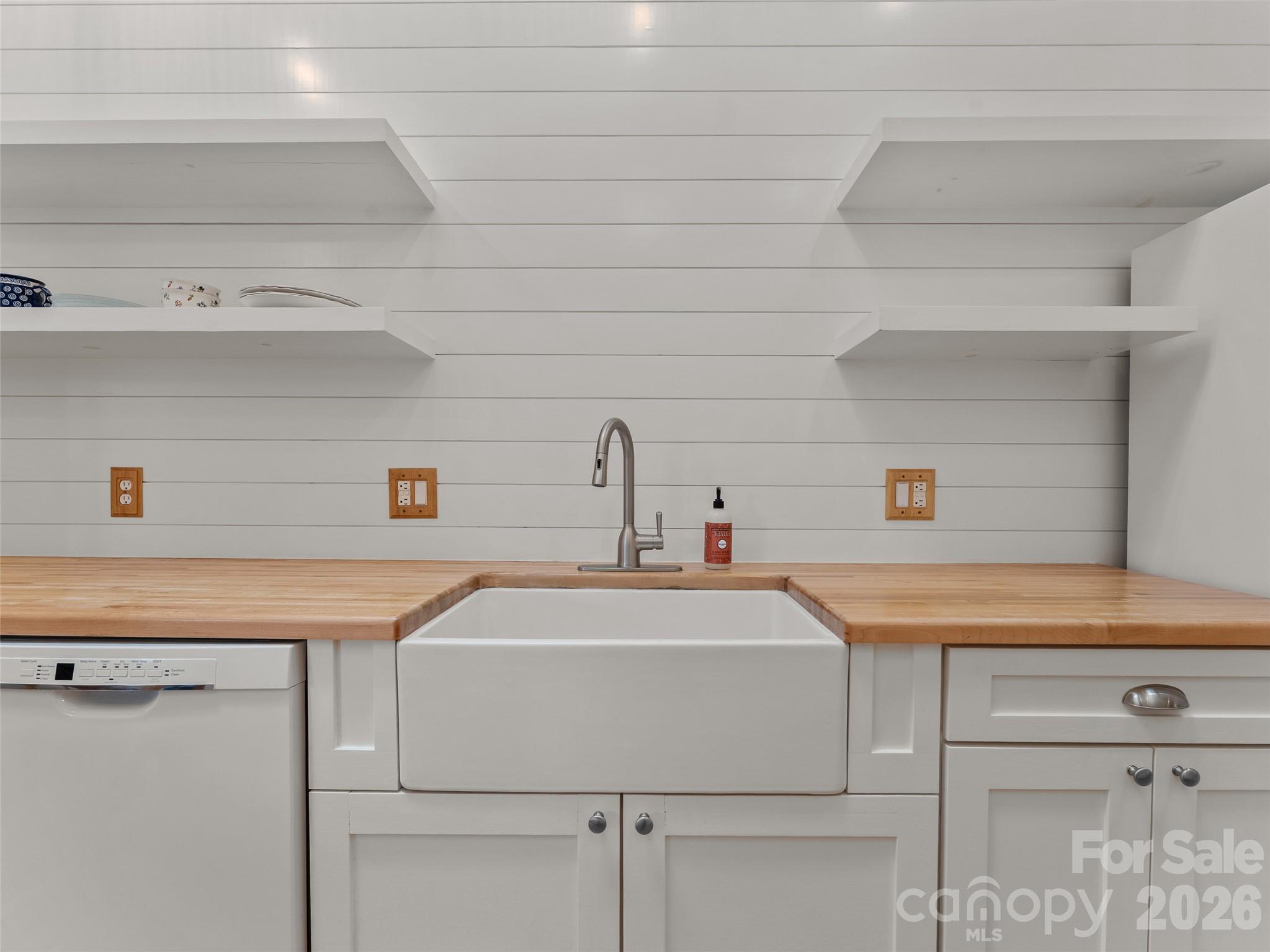 203 Heathcote Road Hendersonville, NC 28791 - Photo 13 of 47 a utility room with washing machine and sink