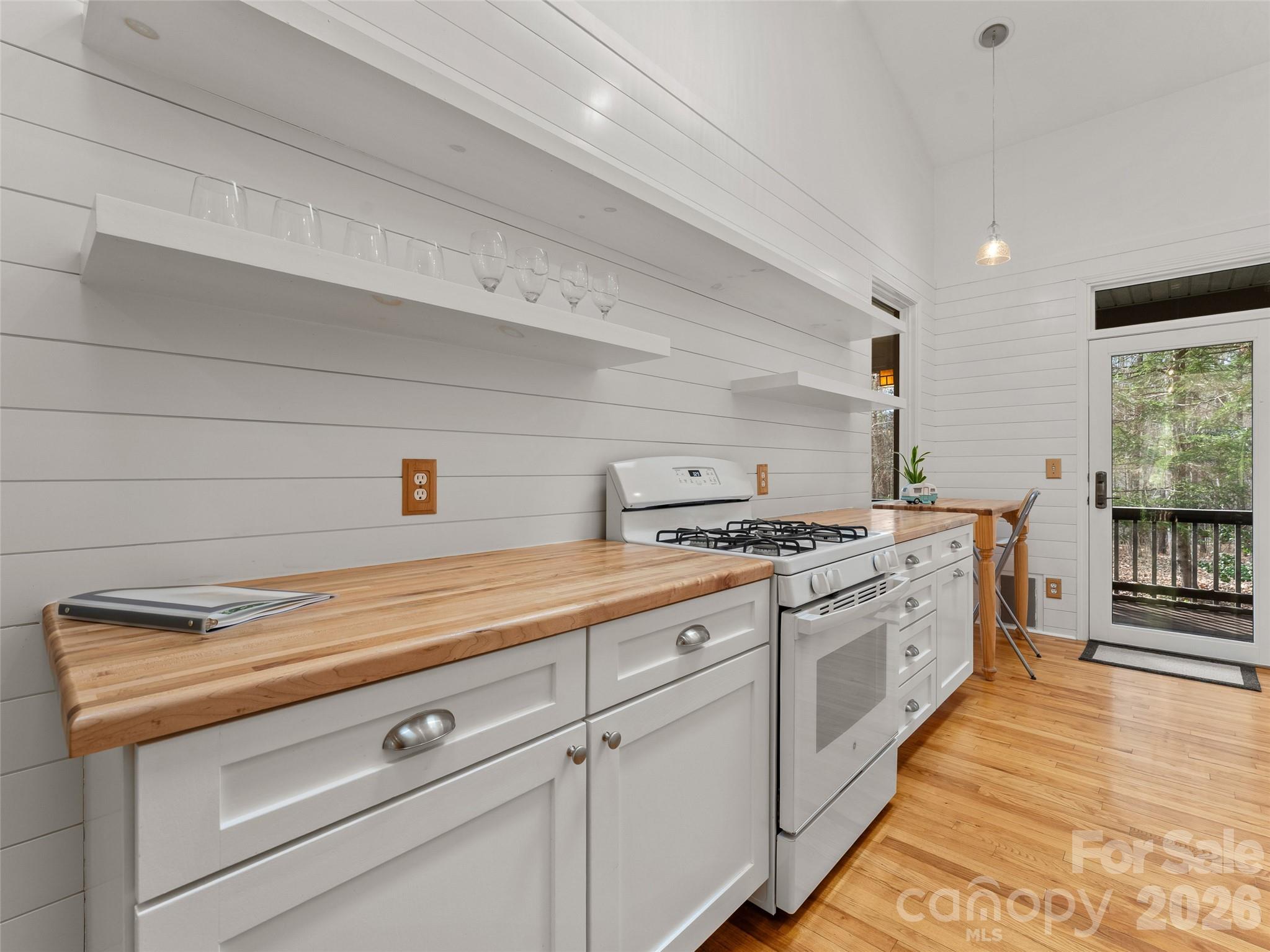 203 Heathcote Road Hendersonville, NC 28791 - Photo 14 of 47 a kitchen with cabinets and appliances