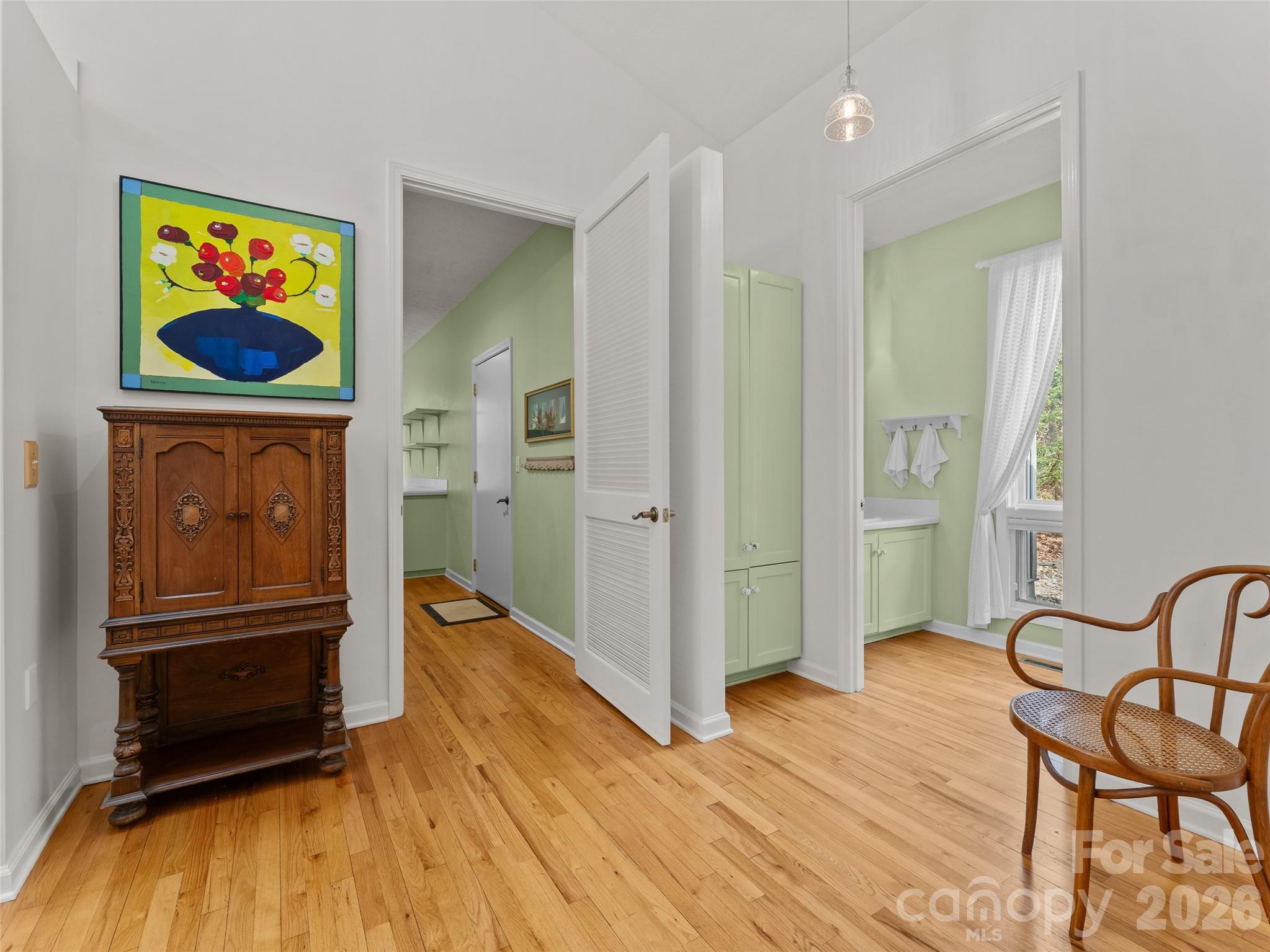 203 Heathcote Road Hendersonville, NC 28791 - Photo 16 of 47 a view of a livingroom with furniture wooden floor and windows