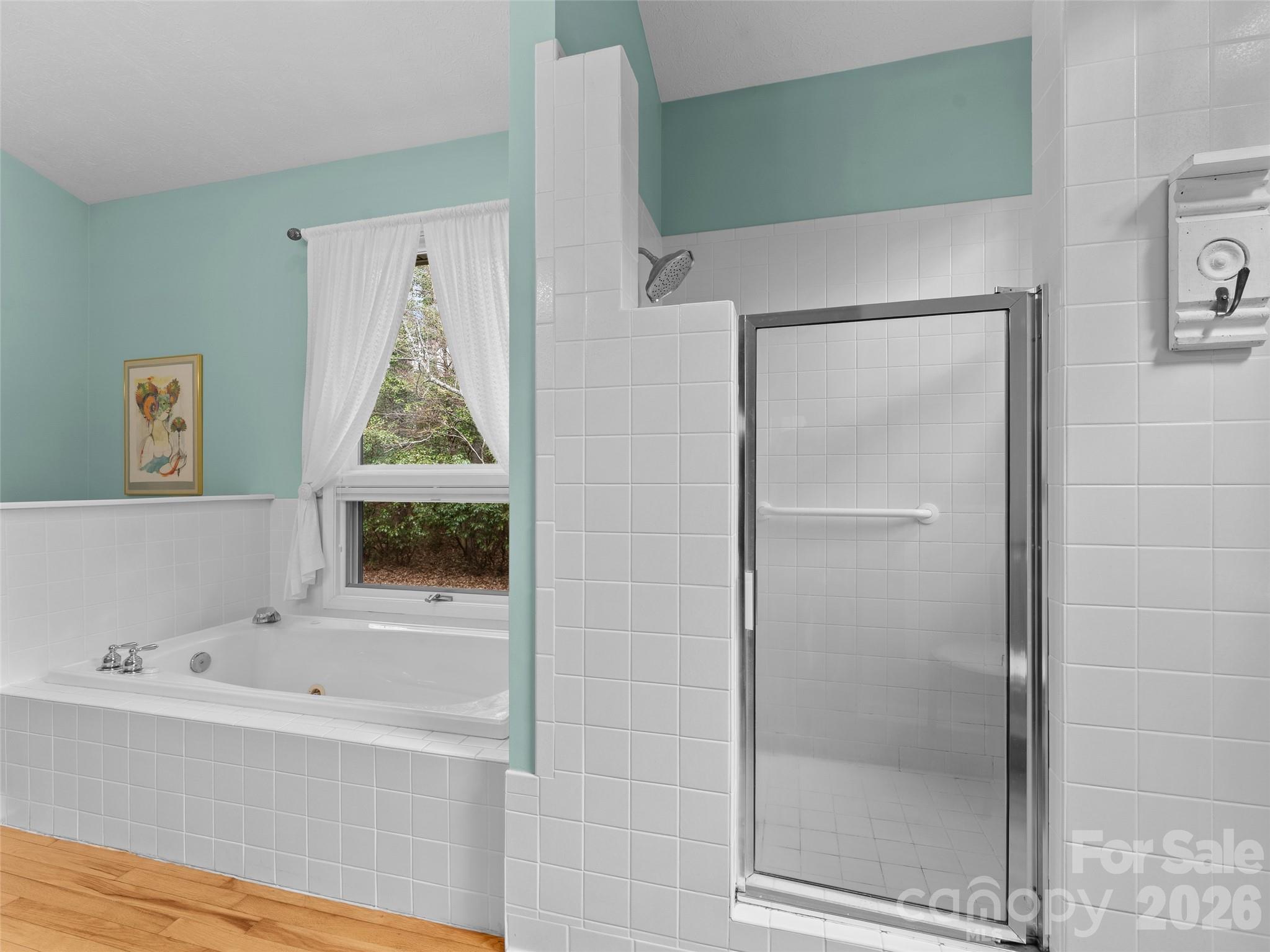 203 Heathcote Road Hendersonville, NC 28791 - Photo 23 of 47 a bathroom with a bathtub and a shower