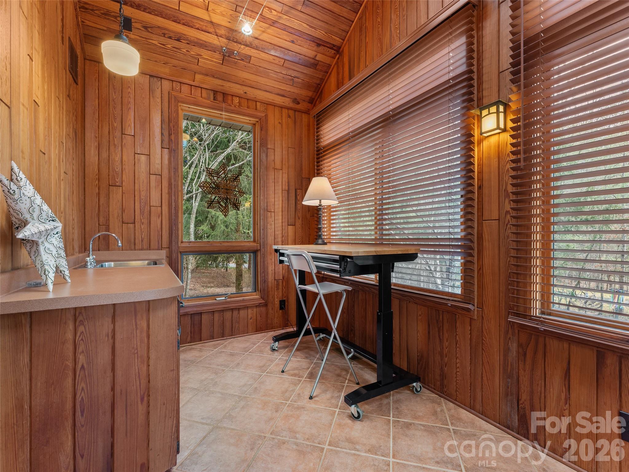 203 Heathcote Road Hendersonville, NC 28791 - Photo 27 of 47 a view of a dinning table and chairs in the balcony
