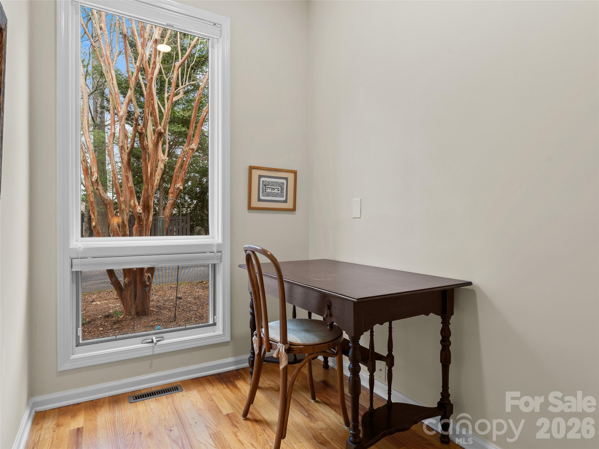 203 Heathcote Road Hendersonville, NC 28791 - Photo 30 of 47 a view of a dining room with furniture window and wooden floor