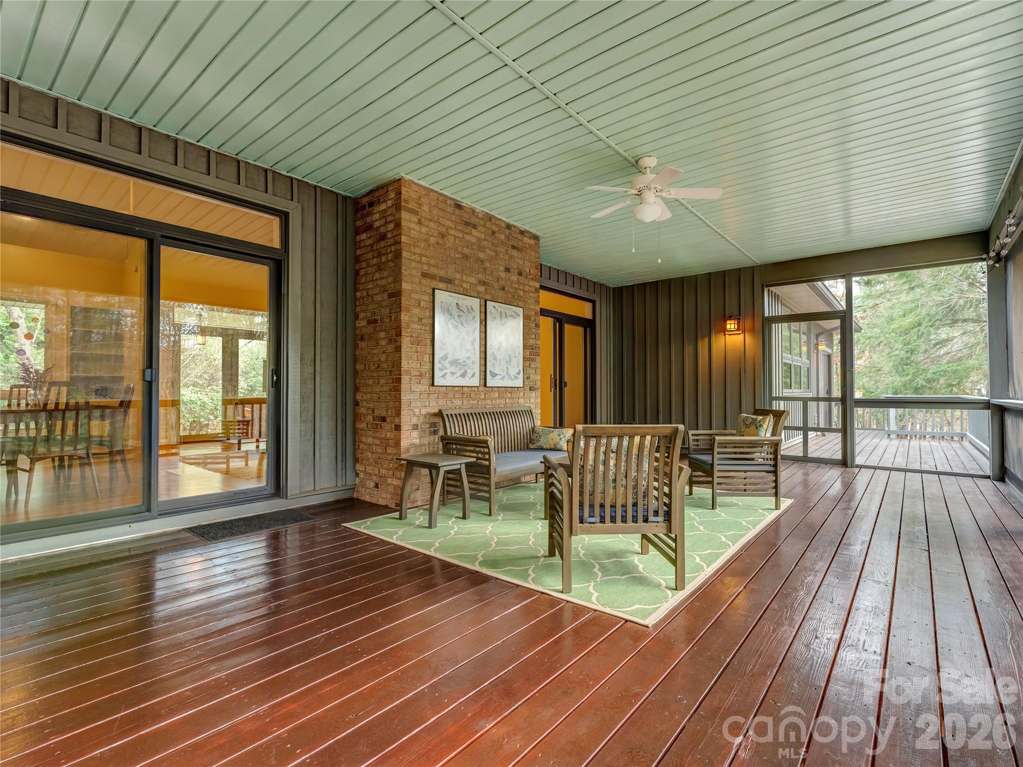 203 Heathcote Road Hendersonville, NC 28791 - Photo 41 of 47 a view of a dining room with furniture window and wooden floor