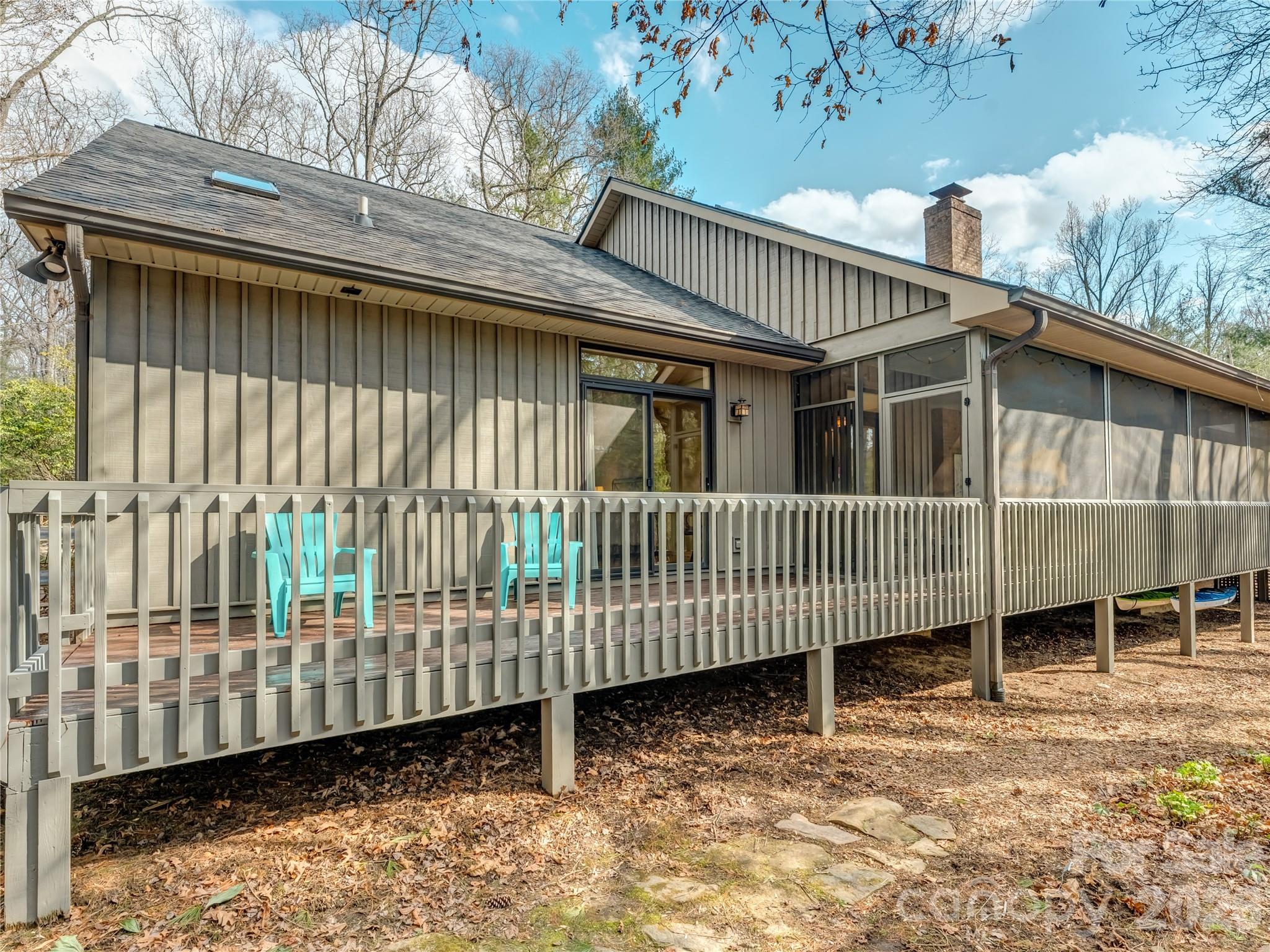 203 Heathcote Road Hendersonville, NC 28791 - Photo 43 of 47 a view of a brick house with a deck