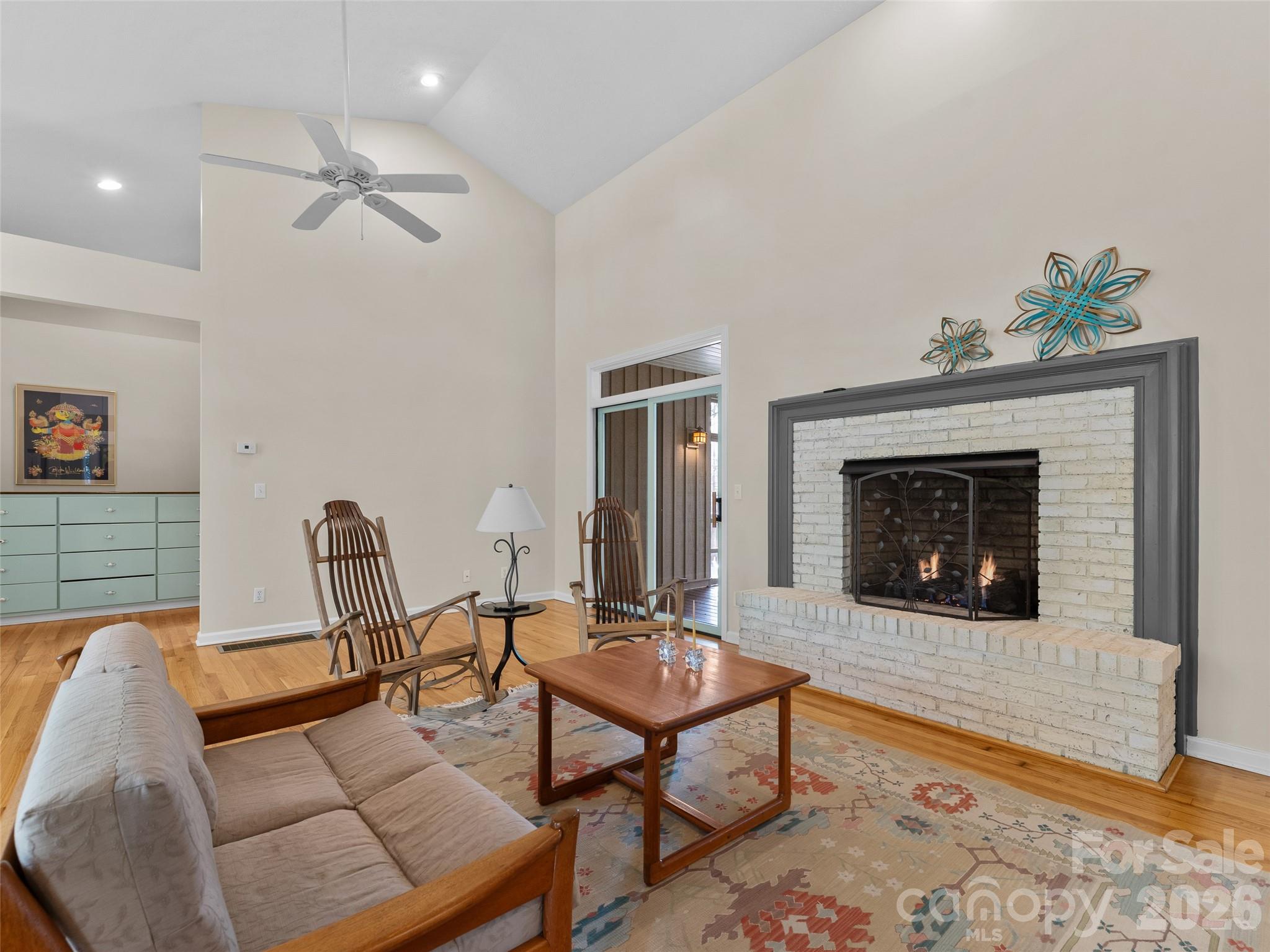 203 Heathcote Road Hendersonville, NC 28791 - Photo 5 of 47 a living room with furniture and a fireplace