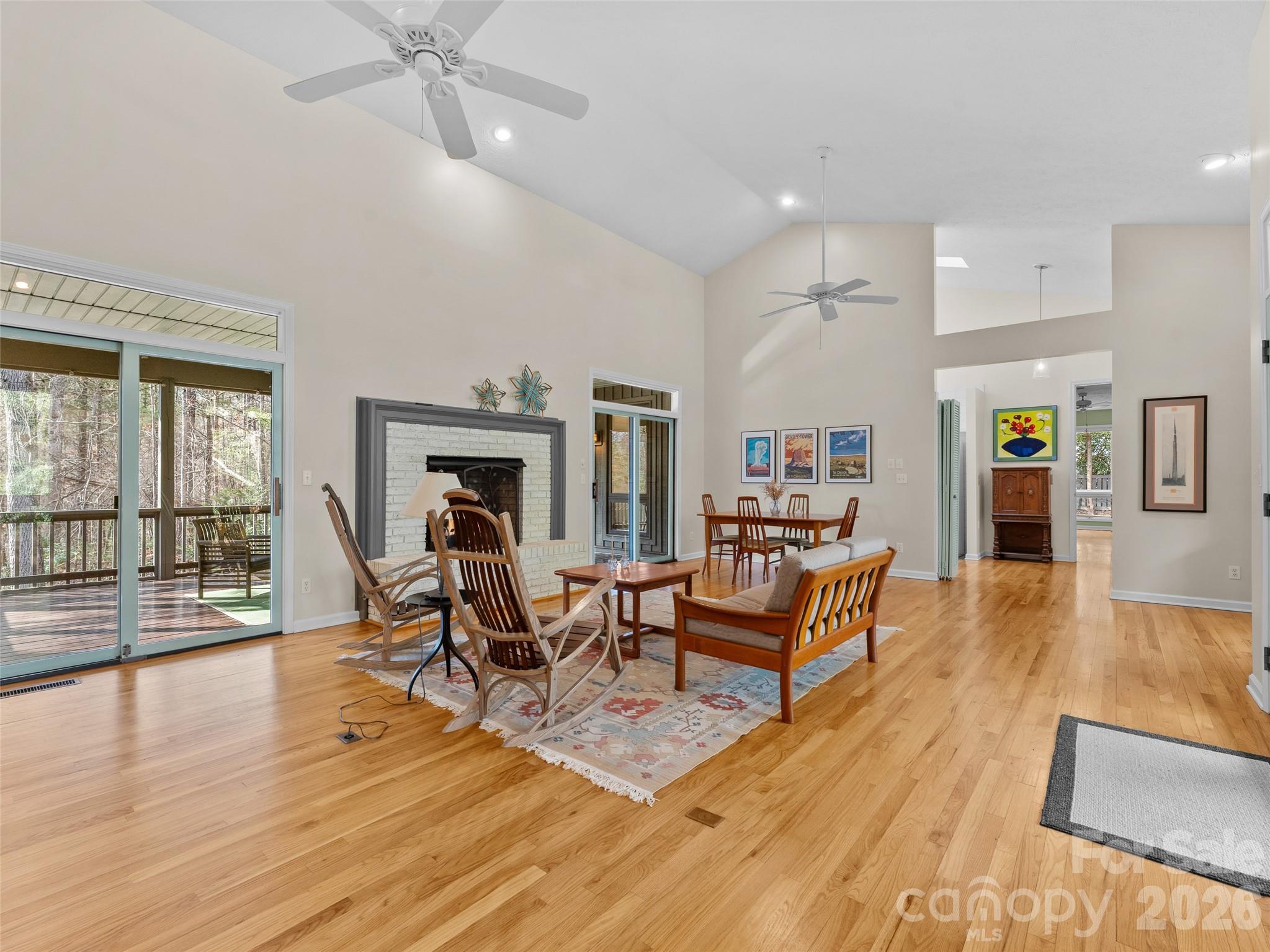203 Heathcote Road Hendersonville, NC 28791 - Photo 6 of 47 a living room with furniture and a wooden floor