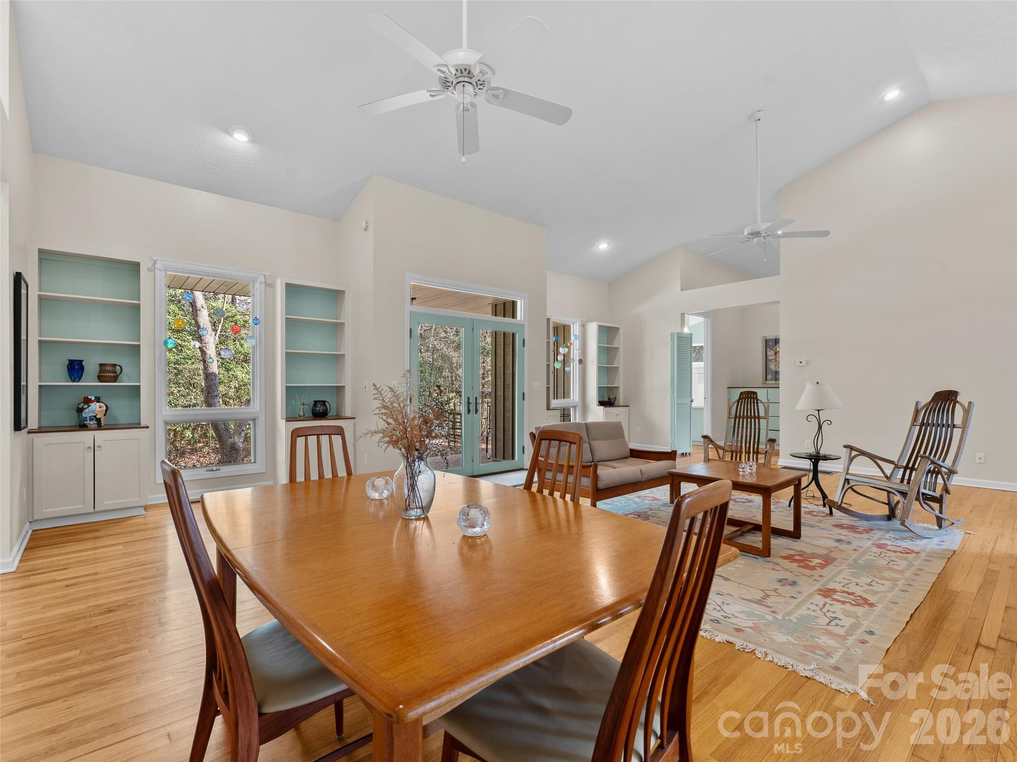 203 Heathcote Road Hendersonville, NC 28791 - Photo 9 of 47 a dining room with furniture a chandelier and wooden floor