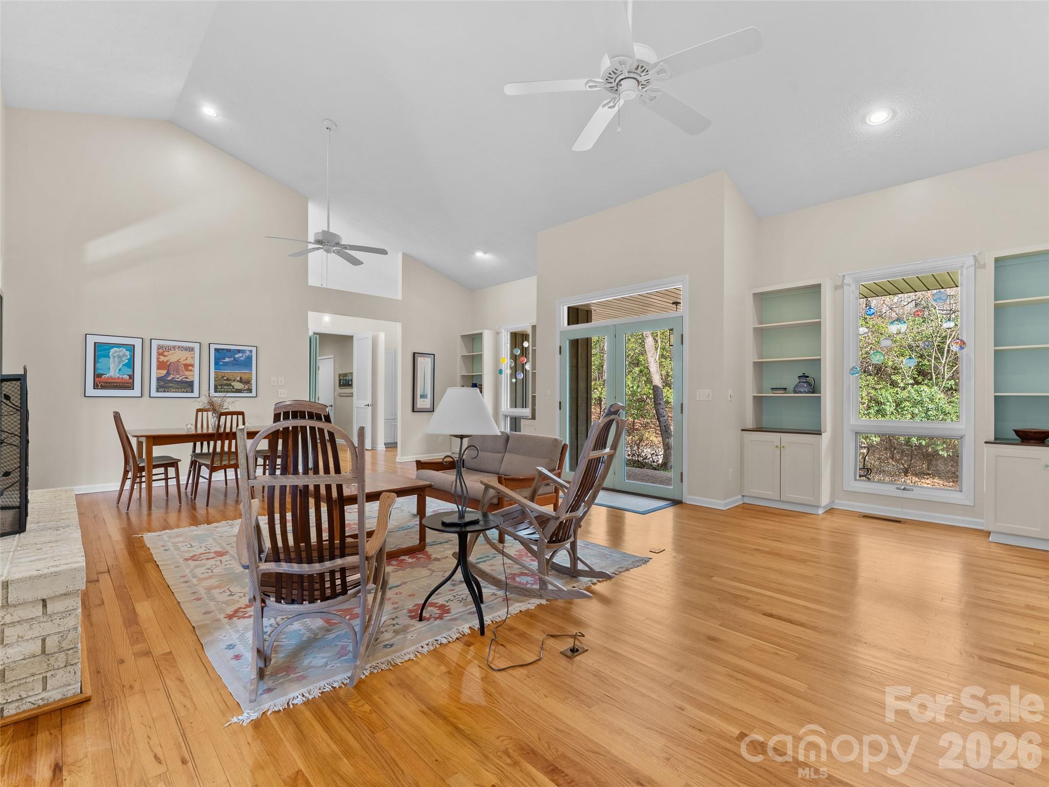 203 Heathcote Road Hendersonville, NC 28791 - Photo 10 of 47 a view of a livingroom with furniture a table and wooden floor