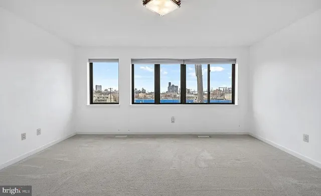 a bathroom with a double vanity sink mirror and toilet