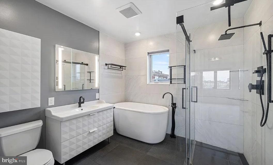928 Wallace Street Philadelphia, PA 19123 - Photo 15 of 19 a bathroom with a double vanity sink mirror and toilet