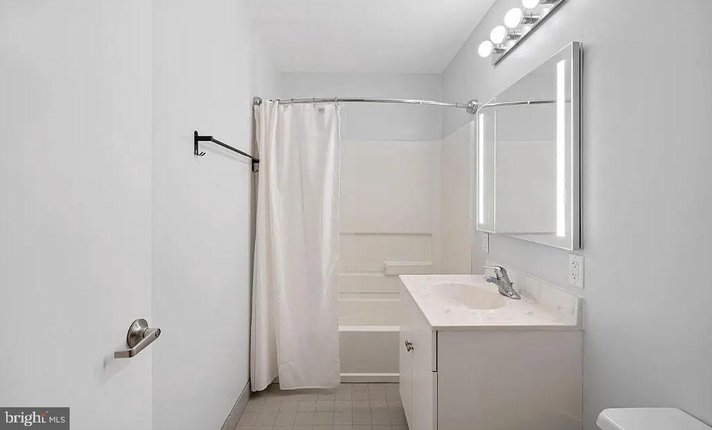 928 Wallace Street Philadelphia, PA 19123 - Photo 17 of 19 a bathroom with a sink a mirror and a shower