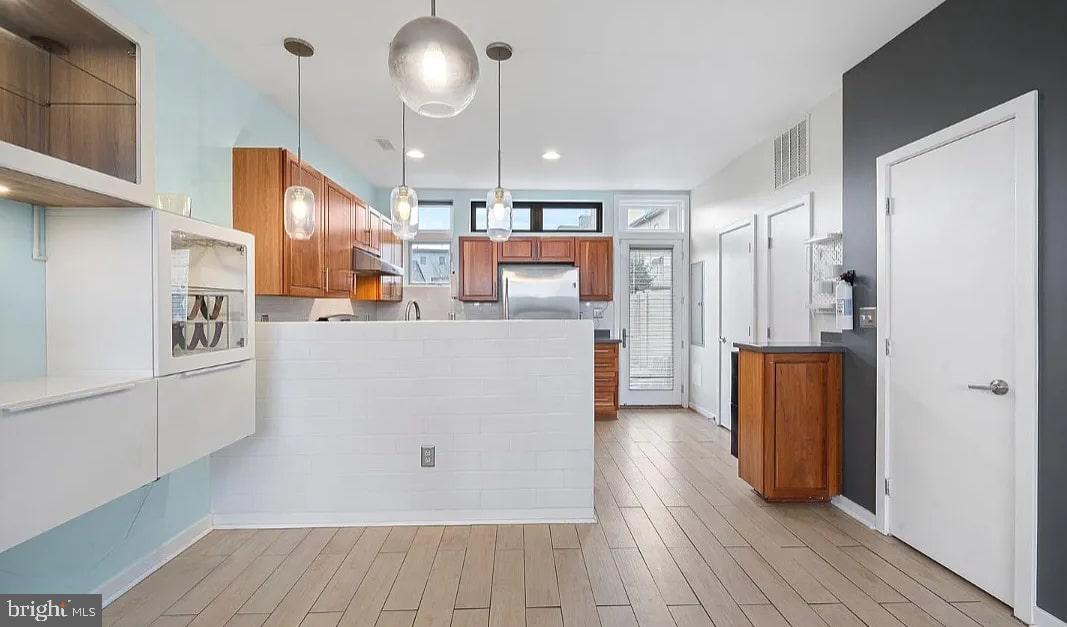 928 Wallace Street Philadelphia, PA 19123 - Photo 2 of 19 a view of kitchen with cabinets and wooden floor