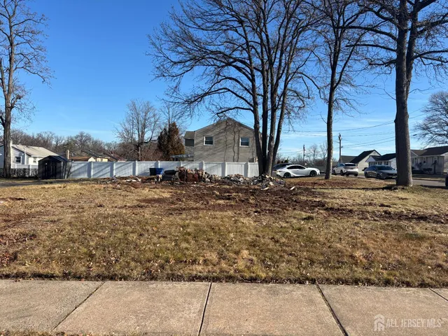 a view of yard covered with snow in front of house