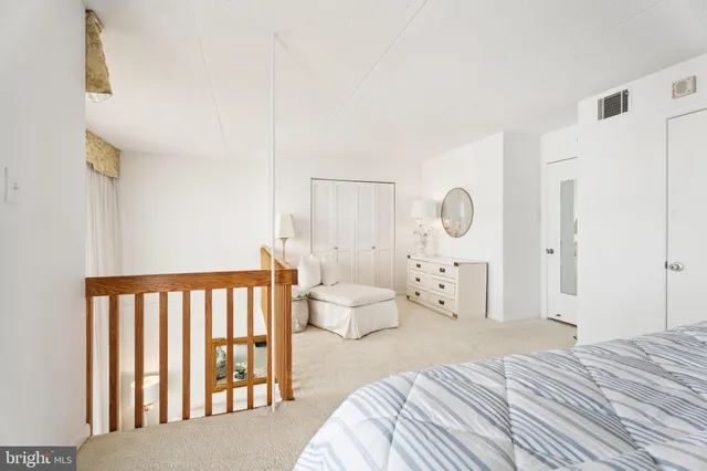 a bathroom with a sink a toilet a mirror and shower