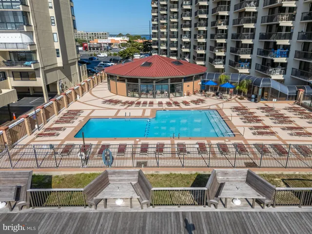 a view of a swimming pool with a yard