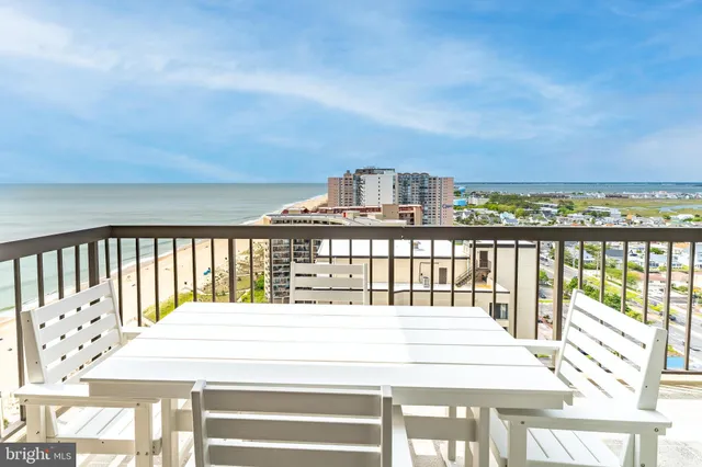 a bedroom with two beds and a large window