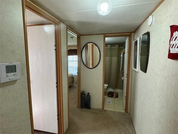 a bedroom with a bed a couch and a window