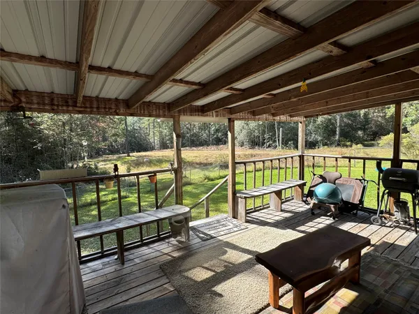 a view of yard with swimming pool and green space