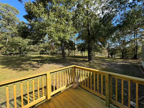 a view of wooden deck with a yard