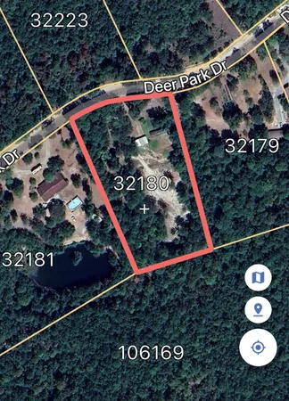 a view of a swimming pool with an outdoor space and seating area