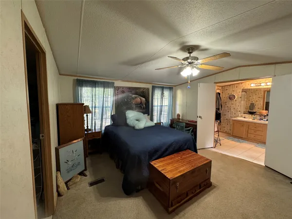 a spacious bathroom with a sink a large mirror and a bathtub