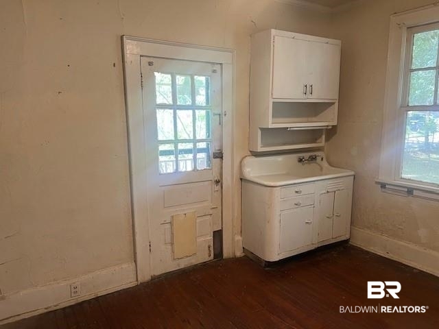 321 Grant Street Chickasaw, AL 36611 - Photo 10 of 13 Doorway with dark wood-style floors and a sink