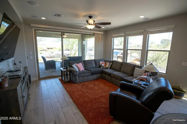 a living room with furniture and a window