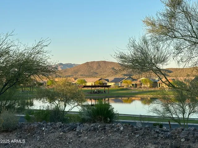 a view of a house with backyard porch and sitting area