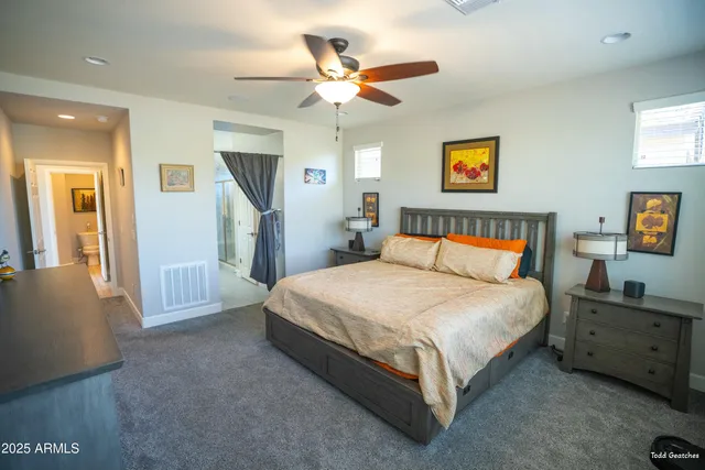 a bedroom with furniture and a window