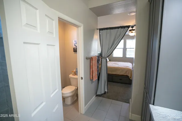 a bathroom with a shower and a sink