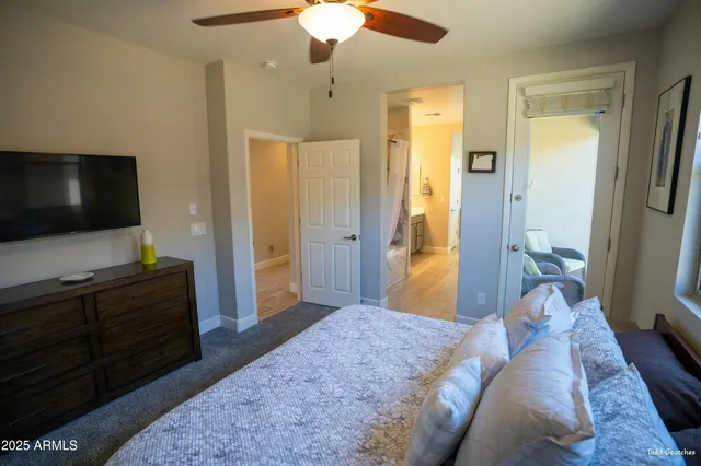 a room with a bed furniture and a window