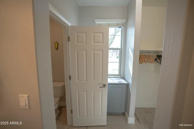 a view of a lush green hillside and a houses