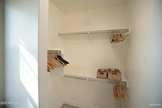 an aerial view of a house with a lake