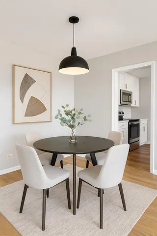 a kitchen with stainless steel appliances a refrigerator a sink and wooden cabinets