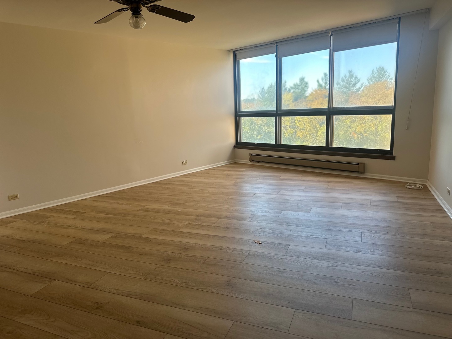 101 Bar Harbour Road, Unit 6D Schaumburg, IL 60193 - Photo 8 of 14 wooden floor in an empty room with a window