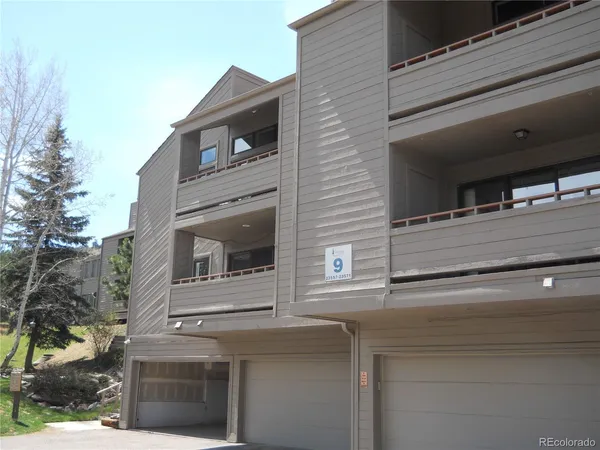 a front view of a house with a garage