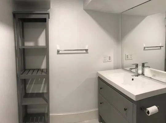 a bathroom with a sink and a mirror