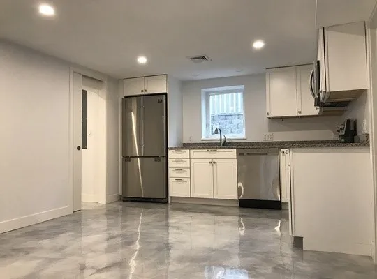 a kitchen with a sink stove and refrigerator