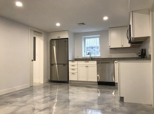 10 Gloucester Avenue, Unit B Gloucester, MA 01930 - Photo 6 of 13 a kitchen with a sink stove and refrigerator