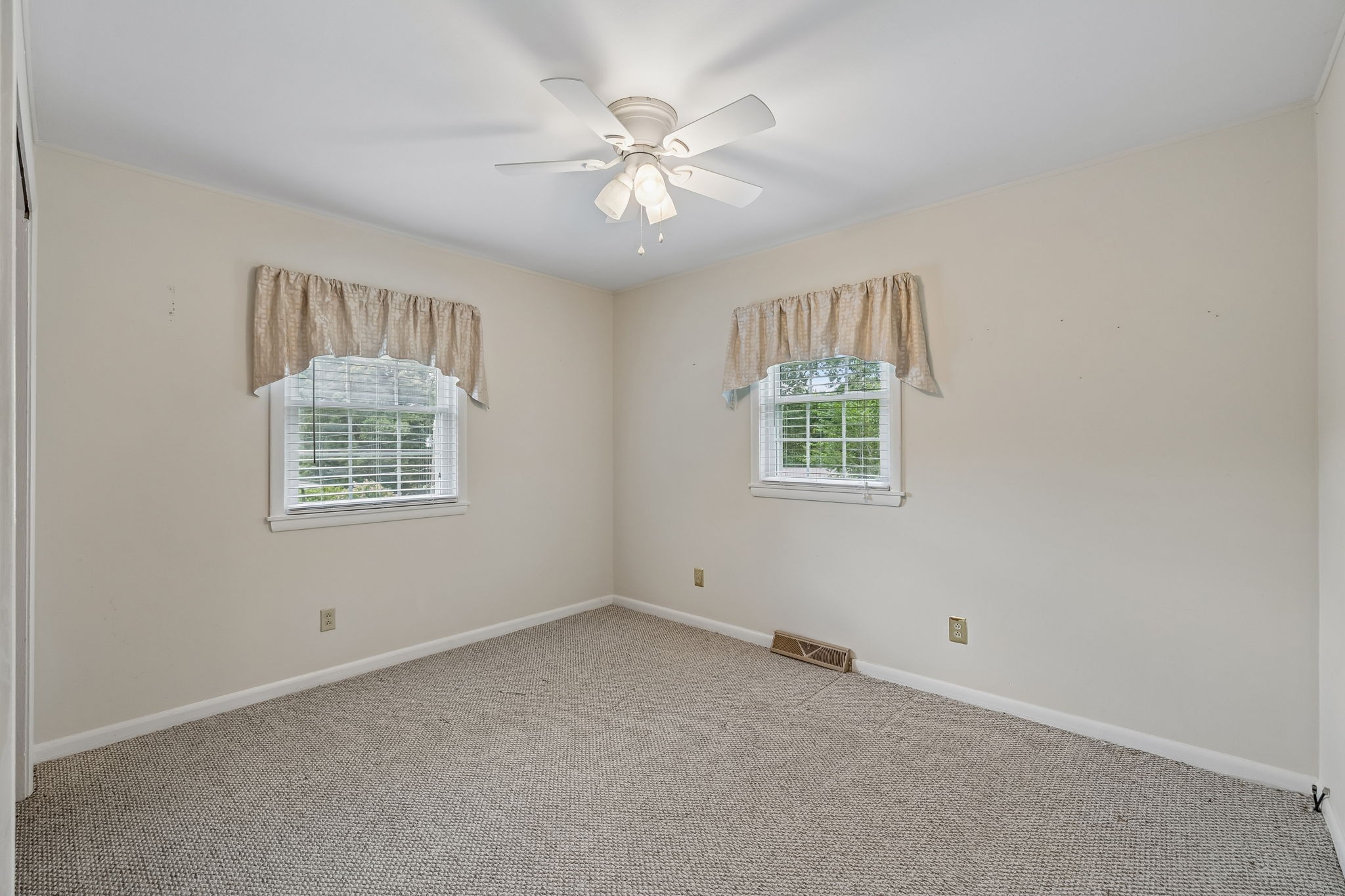 708 Hickory Street Centerville, TN 37033 - Photo 30 of 57 an empty room with windows and fan